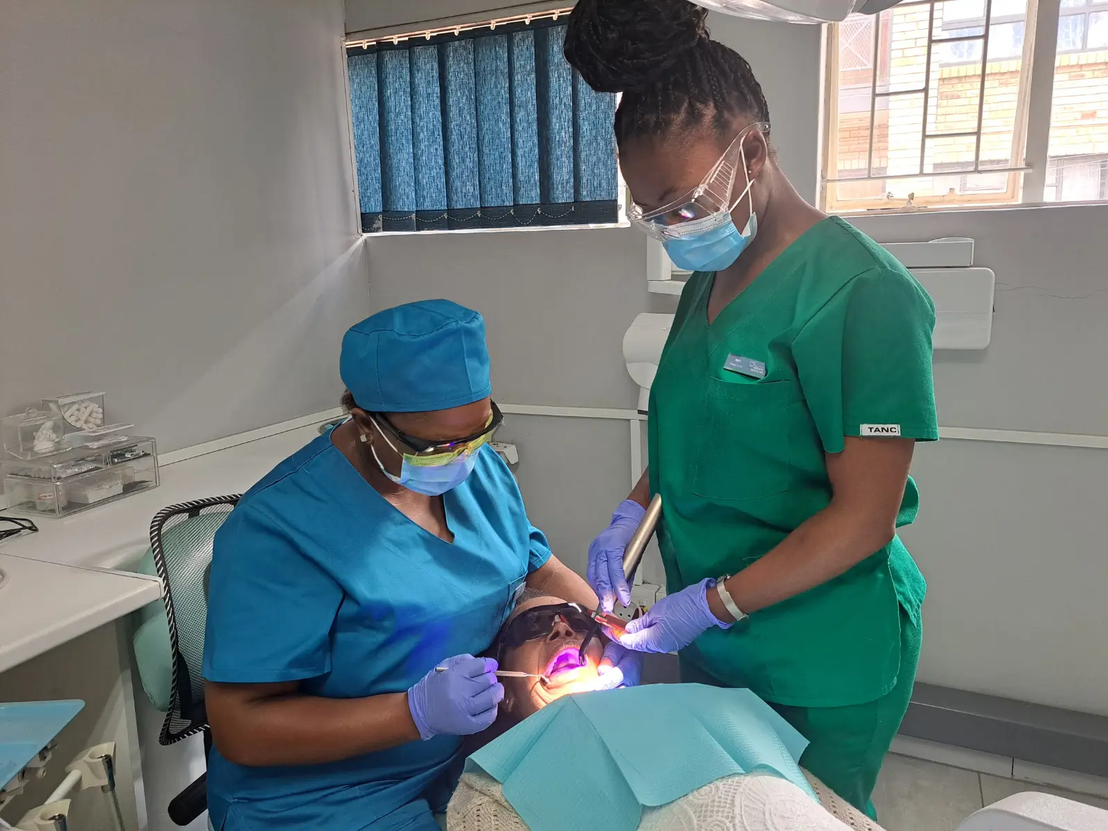 Dr Molapo and Neo working on a patient